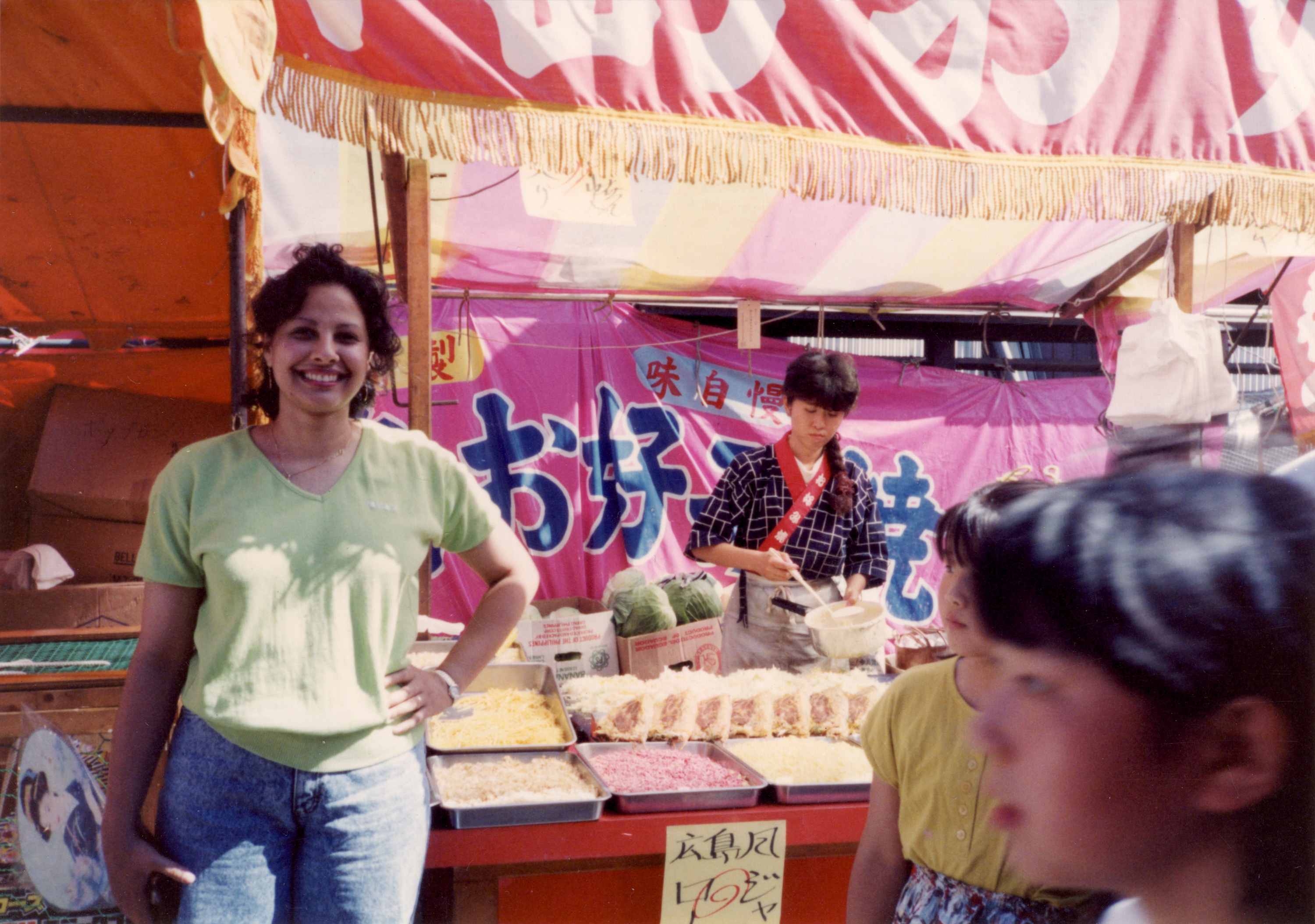 Ghada at a market stall in Japan